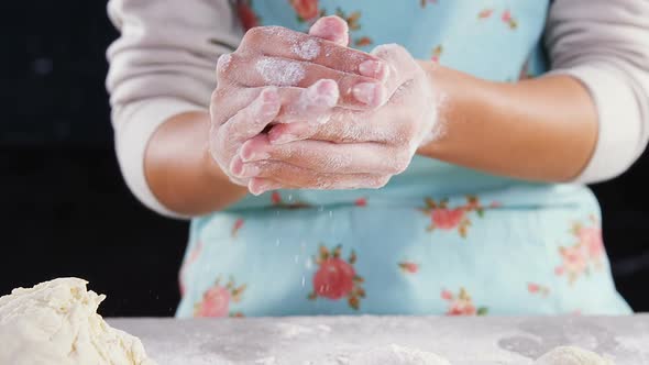 Woman preparing a dough ball 4k