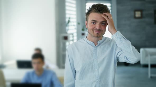 Confident Happy Office Worker Looking at Camera in Modern Office, Positive Male Employee with