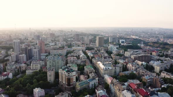 Aerial view of a beautiful and cozy evening city with narrow streets