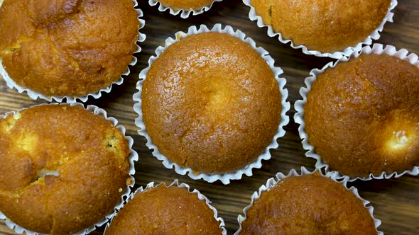 Top View Baking Muffins Rotate On A Turntable, Top View Of Mouth Watering Muffins.