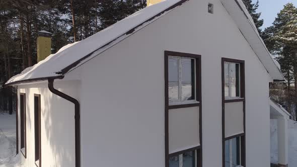 Aerial view of new white modern residential house at winter near the forest 12