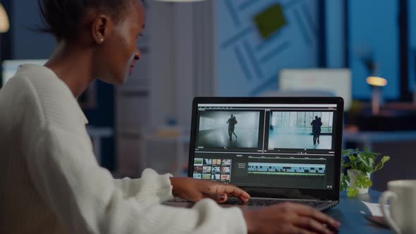 African Videographer Working at Laptop From Office Editing Video Project