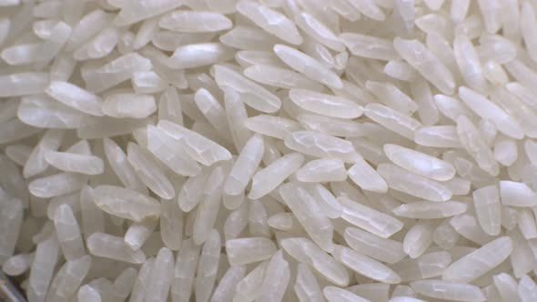 White Polished Long Rice Closeup in Macro Mode Rotates in a Circle
