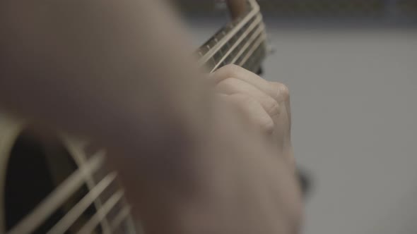 Hands playing the guitar