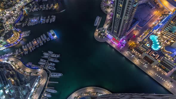 Dubai Marina Harbor with Modern Yachts Aerial Night Timelapse