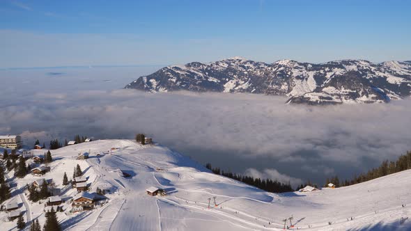 ski area in the Swiss alps with people and chairlifts in the winter ski area of ​​Beckenried