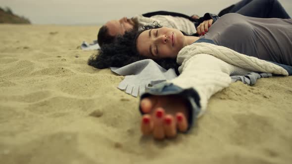 Hispanic Couple Chilling Beach Sand By Sea