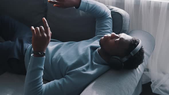 African American Man Wearing Headphones Listening to Music