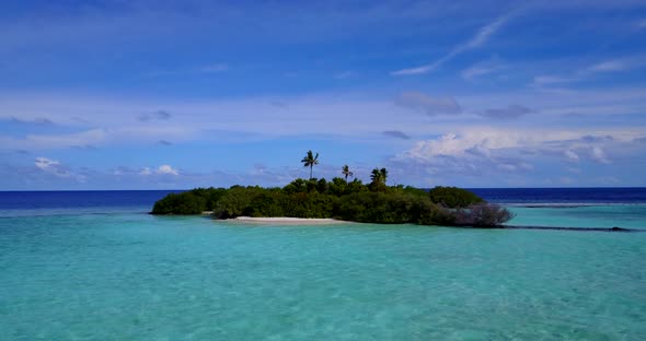 Luxury above abstract shot of a white paradise beach and blue ocean background in colorful 4K