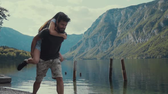 Amorous traveling couple on pier