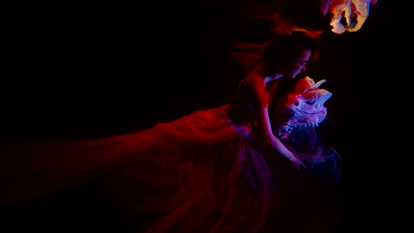 Magic and Mysterious Underwater Shot with Woman and Dragon Head Mysterious Deepness