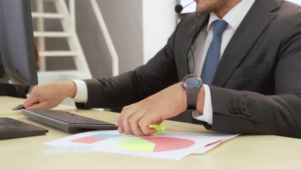 Business People Wearing Headset Working in Office