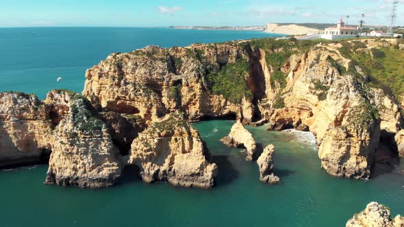 Ponta da Piedade Lighthouse atop cliff in Lagos, Algarve, Portugal