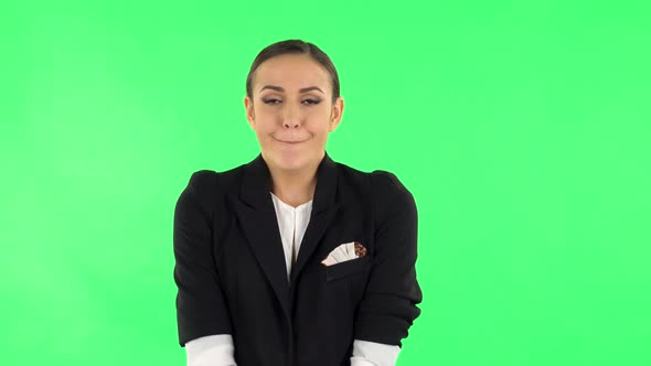 Woman Disappointed Looks in Camera Bites Her Lip Then Shrugs. Green Screen