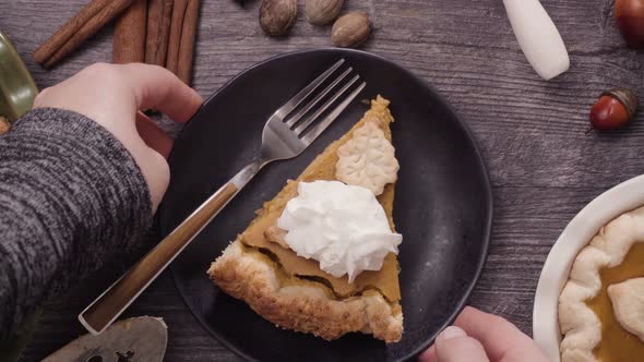 Step by step. Eating slice of freshly baked  pumpkin pie.