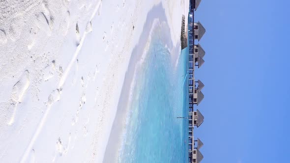 Tropical Pristine Beach with Water Bungalows at Maldivian Island