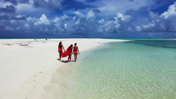 Tourists tanning on beautiful shore beach holiday by blue green ocean with white sand background of 