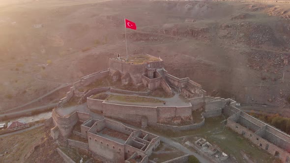 Flying Around of the Turkish Flag Over the Castle of Kars in Turkey