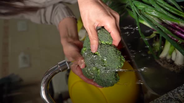 Hands Of A Woman Washing Broccoli With Running Water From A Faucet. - Closeup, Slow Motion