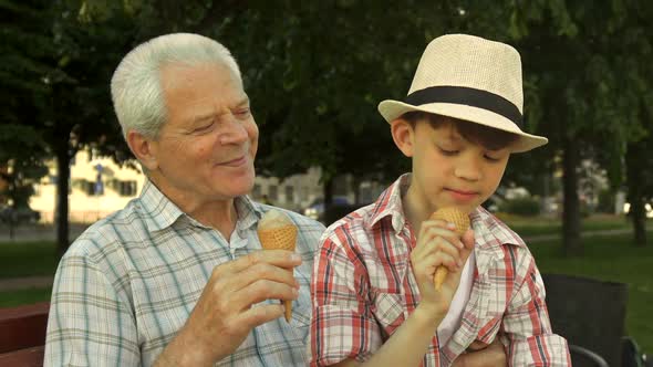 Little Boy Shows His Thumb Up Near His Grandpa