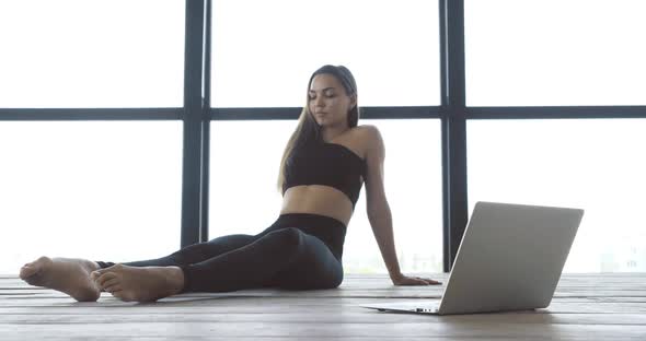 Young Woman Dancer Trainer in Black Suit Conducts Training Dance Lesson Online for Students Through