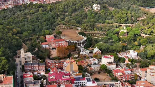 Aerial drone view of Barcelona, Spain. Park Guell with tourists, a lot of greenery