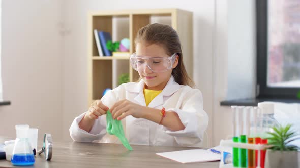 Girl Playing with Slime at Home Laboratory