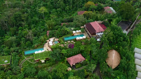 aerial pan down of a beautiful pool at a resort in Munduk Bali Indonesia