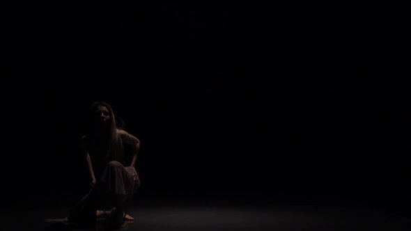 Charming Performer Dancing Contemp in Twilight Against Black Background. Slow Motion