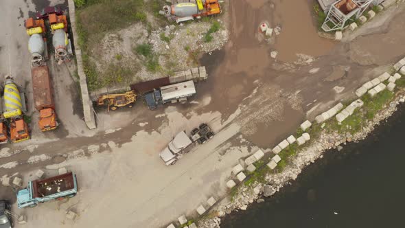 Top Down Overhead Aerial View of the Truck Without a Trailer Arriving at a Maritime Cargo Port