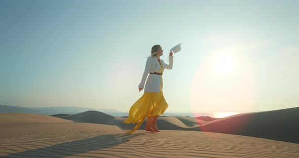 Stylish Girl Having Fun in Desert