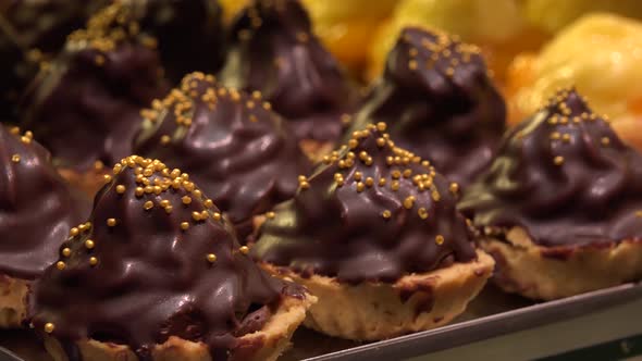 Closeup on Fruit and Chocolate Cupcakes on Metallic Trays