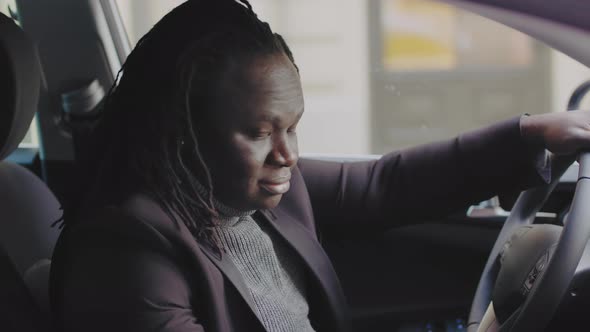 Young African American Black Businessman Sitting on the Drivers Car Seat and Showing Thumb Up