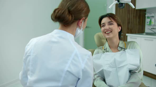 Young Girl and Dentist Have a Fun Conversation