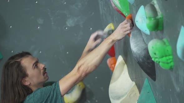 Сlimber Training on a Climbing Wall Practicing Rockclimbing Mountaineer Training Physical Activity