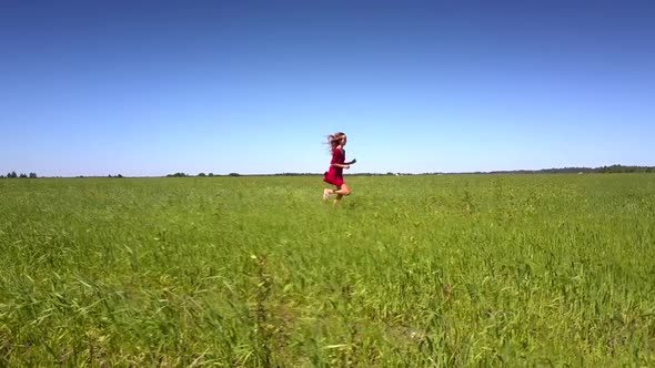 Flycam Films Amazing Girl in Bright Red Dress Running Fast