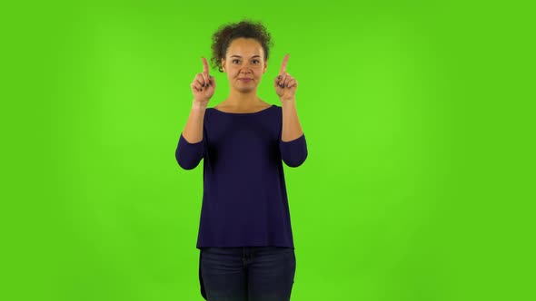 Curly Woman Smiling and Showing Heart with Fingers Then Blowing Kiss. Green Screen