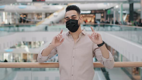 Formal Arabian Indian Hispanic Businessman Arab Man in Medical Mask Looking Camera Indoor in Company