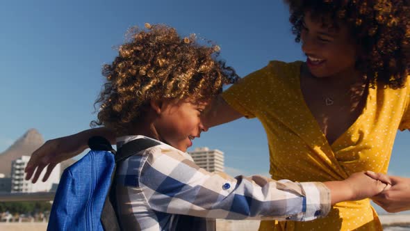 Mother and son having fun together at beach