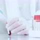 Close up laboratory worker hands work with blood sample in tube. - VideoHive Item for Sale