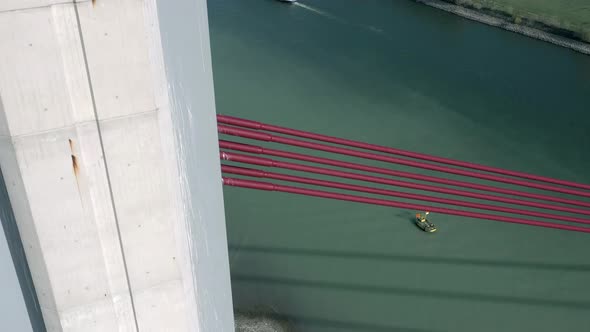 Aerial View of a Cable Stayed Suspension Bridge Crossing a River