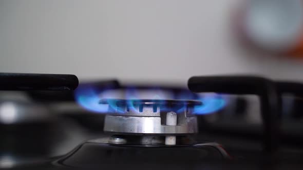 Gas Stove. Gas Stove Burner Comes On. Blue Flame. Slow Motion