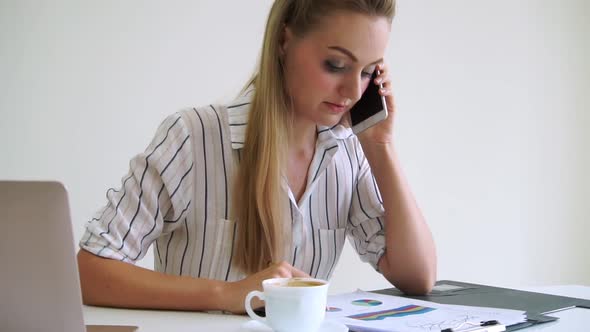 Blonde Business Woman Working at Modern Office