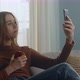 Young Girl with Red Apple Takes a Selfie on Cell Phone - VideoHive Item for Sale