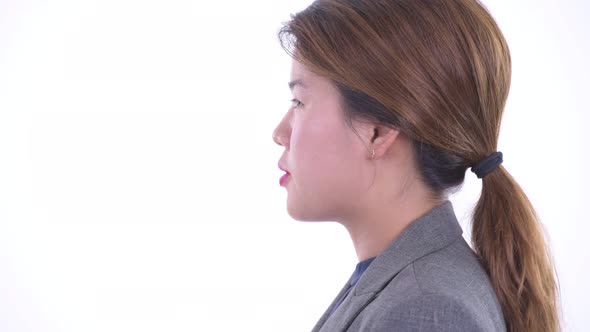 Closeup Profile View of Happy Young Beautiful Asian Businesswoman Talking