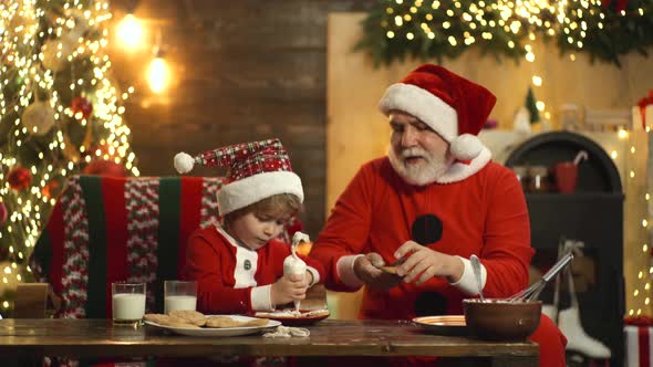 Merry Christmas and Happy New Year. Grandfather with Child Son Making Cookies and Having Fun. Funny