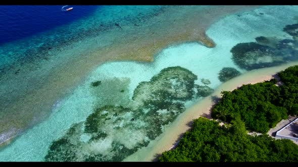 Aerial top down nature of exotic resort beach break by transparent water with white sandy background