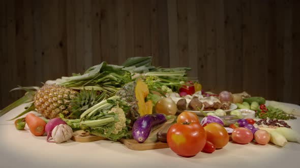 Vegetable And Spice Set On A White Table.