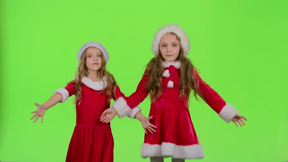 Children in Red New Year Costumes Are Dancing. Green Screen
