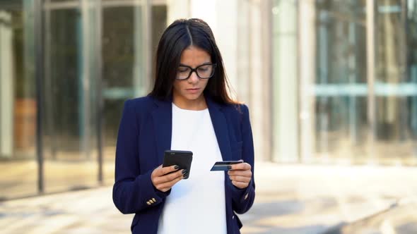 Businesswoman with smartphone and credit card, Student girl using cell phone